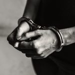 Handcuffed arms
